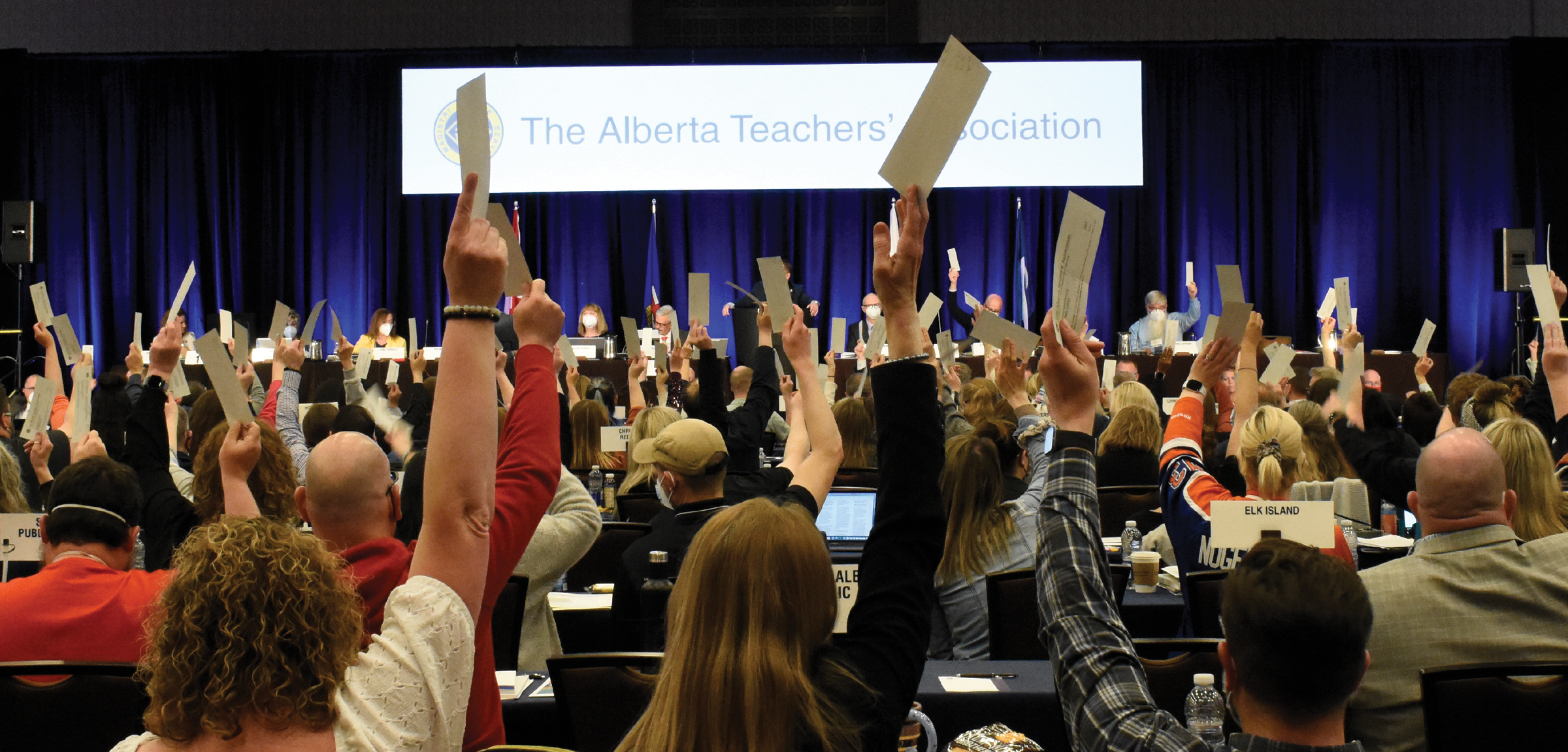 Albertan teachers wave their hands in the air at the 2022 ARA