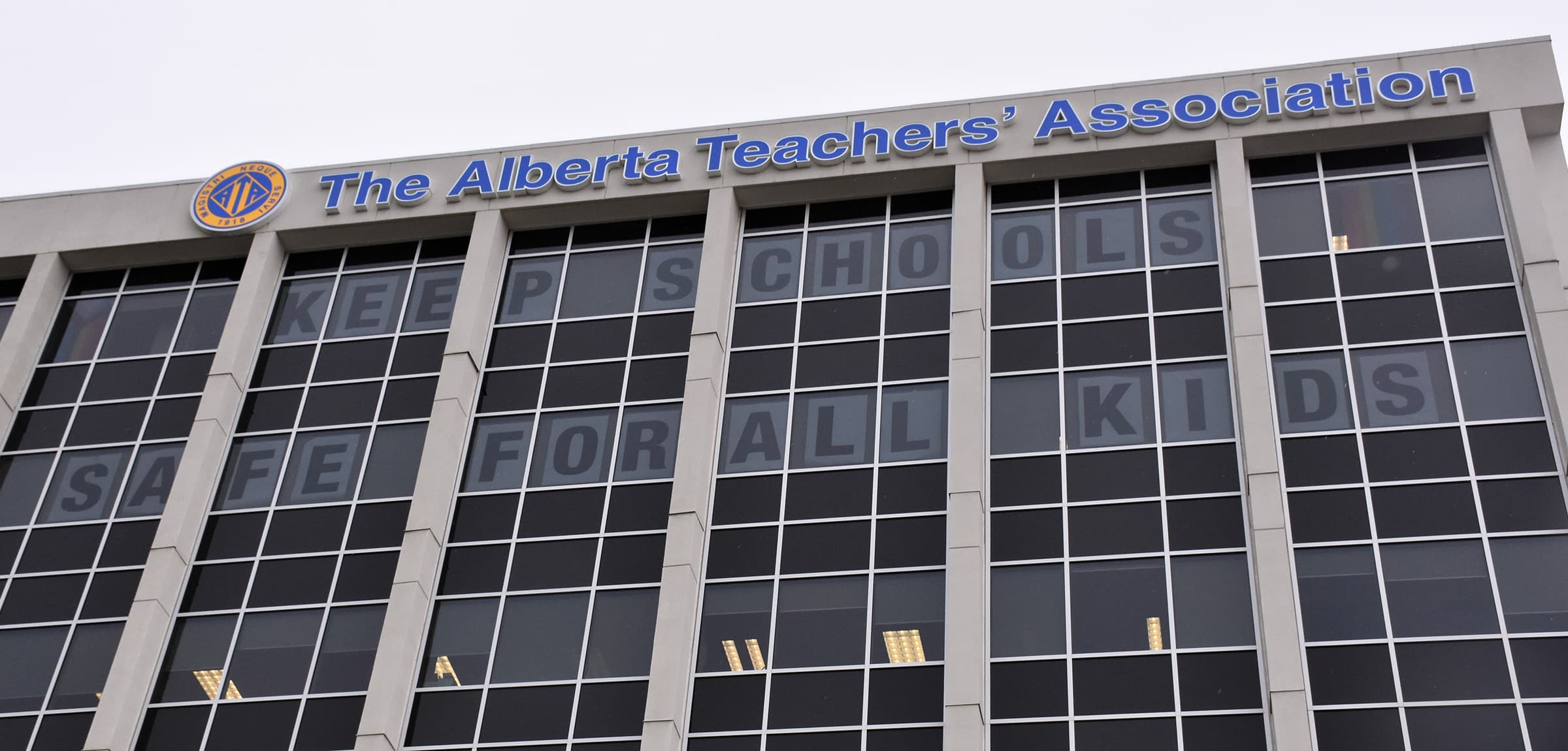 ATA Building with the statement Keep Schools Safe for All Children in the windows of the top two floors