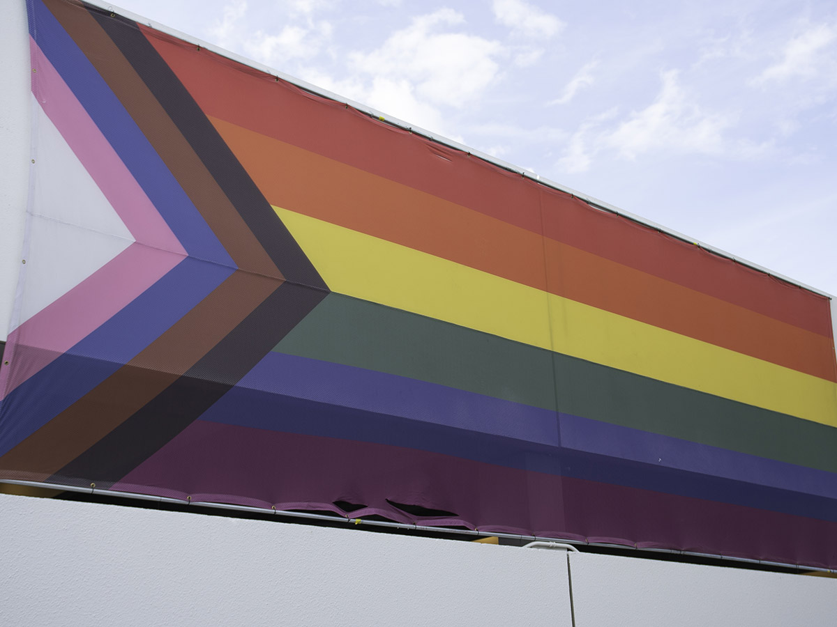Pride flag hung on ATA parkade