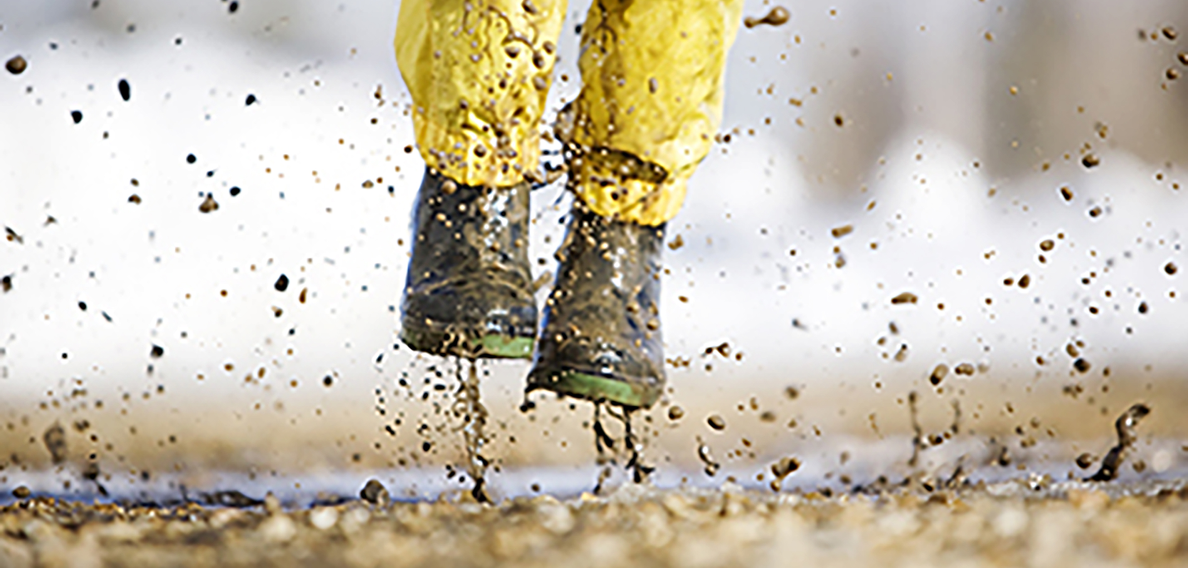 Picture of a child's boots playing in mud