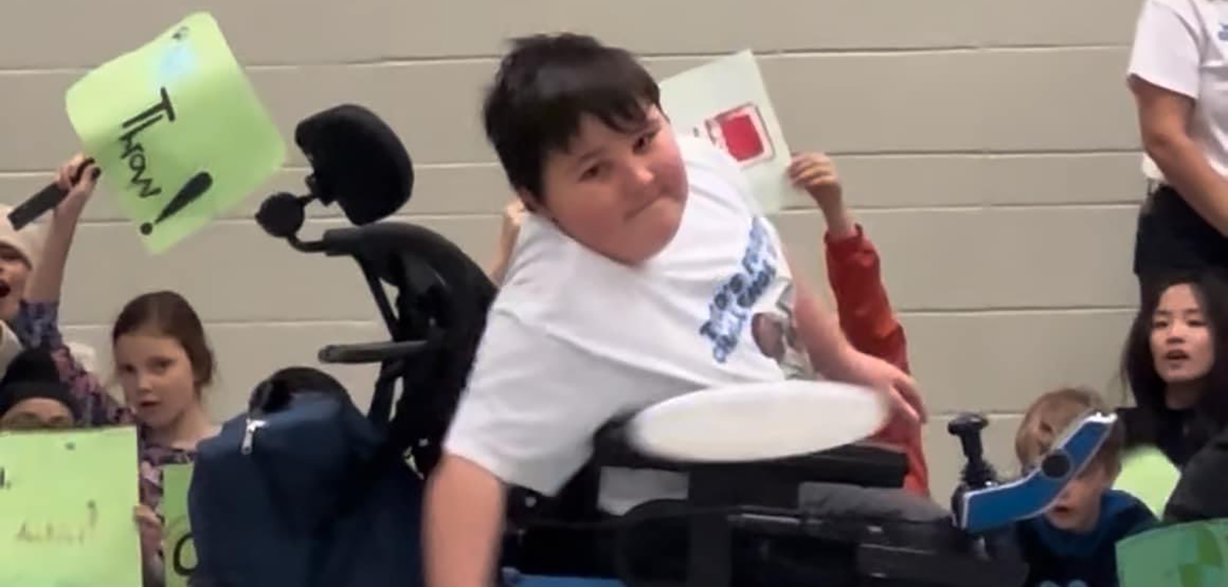 A student throws a frisbee achieving a world record