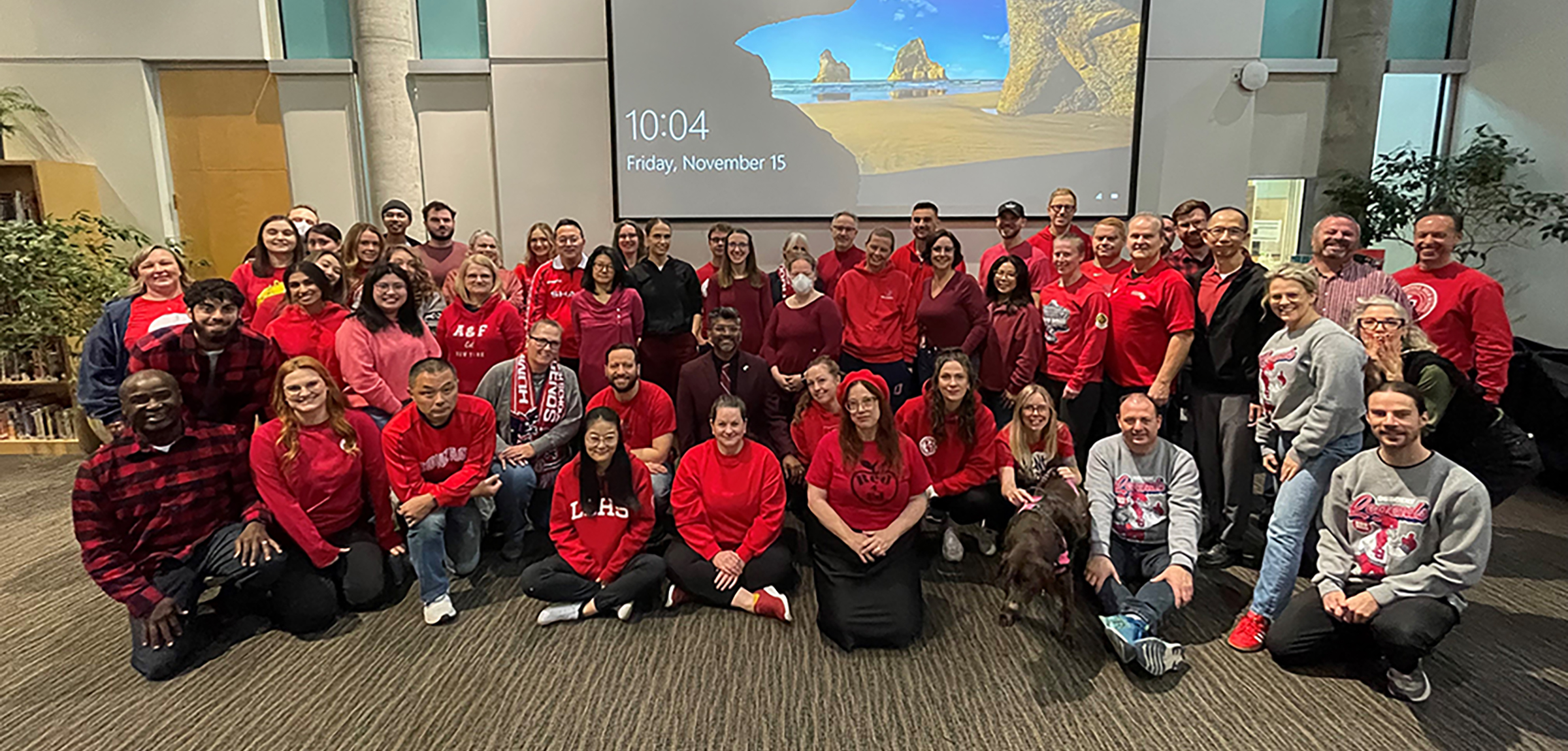 A group of teachers wearing red clothing