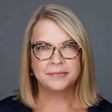 Portrait of blonde woman with a blunt haircut