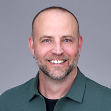 Portrait of man in green collared shirt