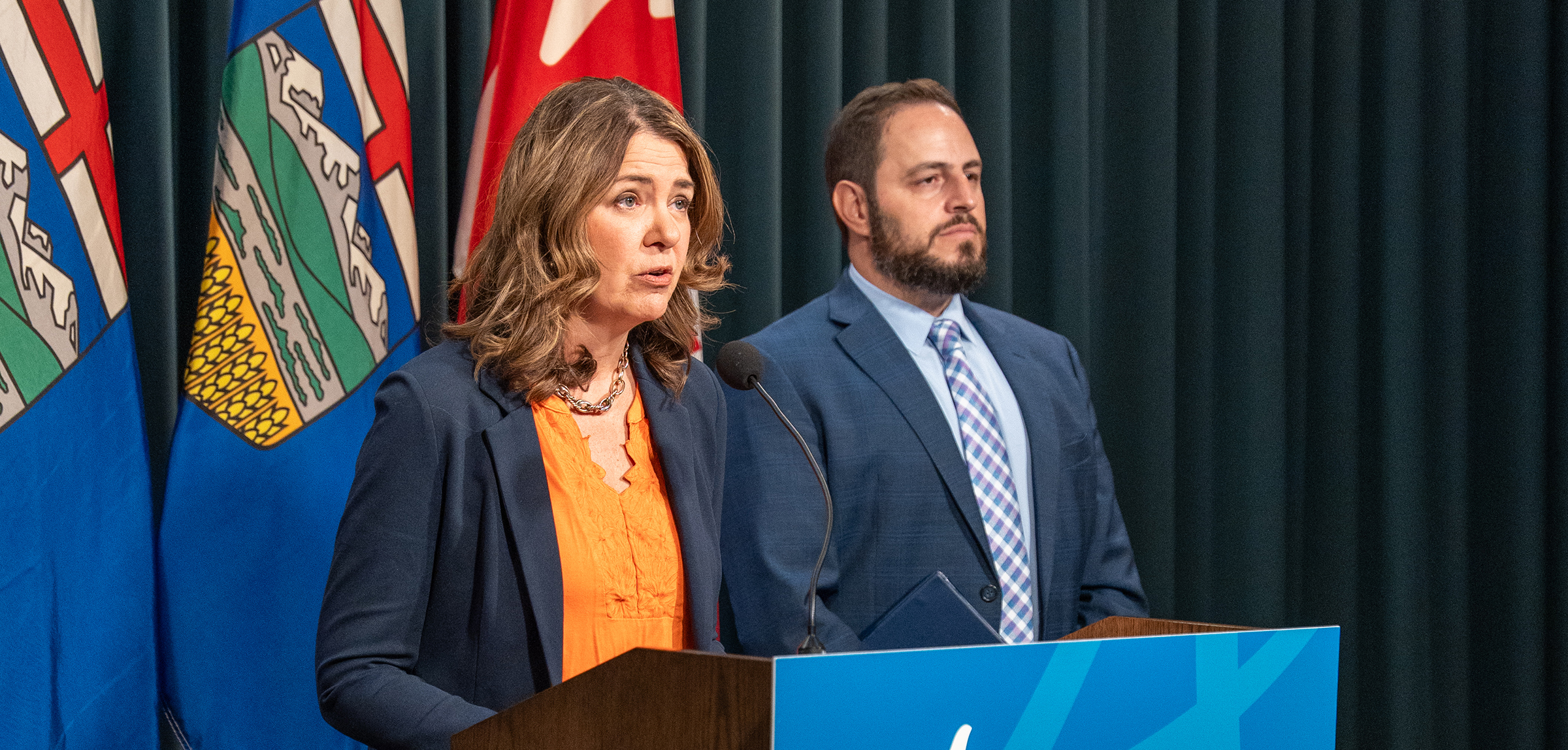 Danielle Smith and Demetrios Nicolaides give a news conference
