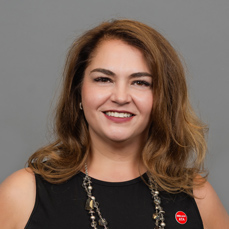 A smiling woman with brown hair