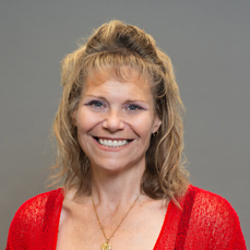 A smiling woman with brown hair