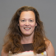 A smiling woman with brown hair
