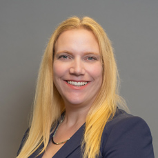 A blonde, smiling woman