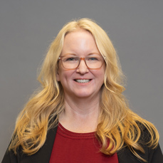 A smiling woman with blonde hair