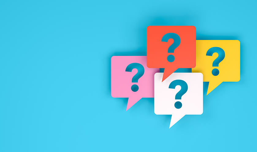 four colourful speech bubbles with question marks