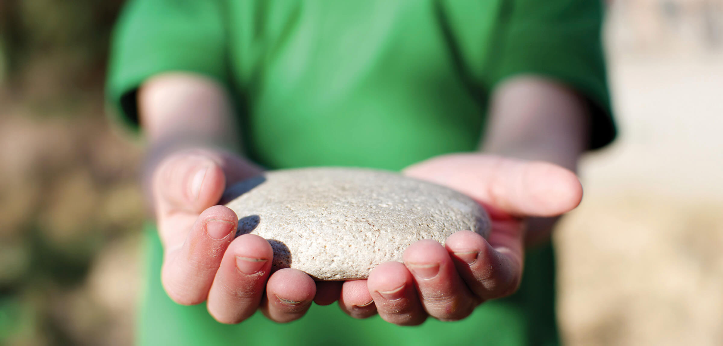 Small boy holding a fish