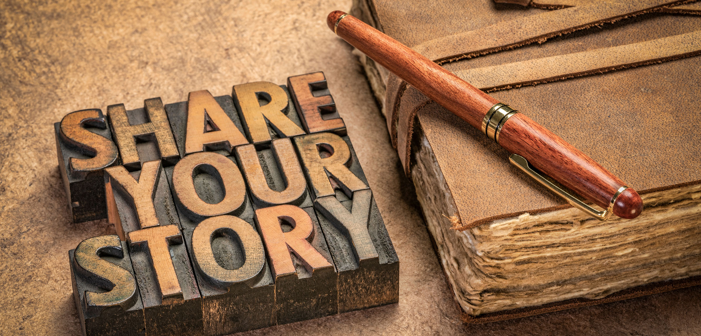 Block printing letters spell out Share your story