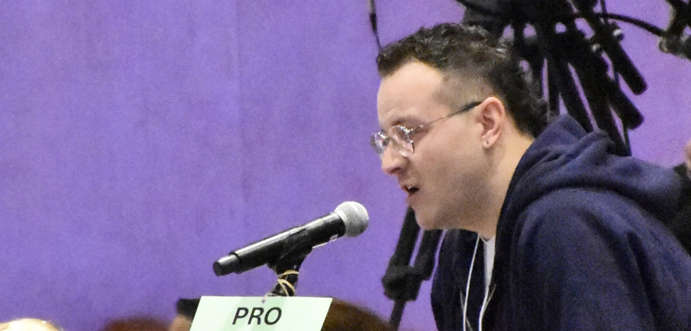 An attendee at the 2026 ARA speaks into a microphone