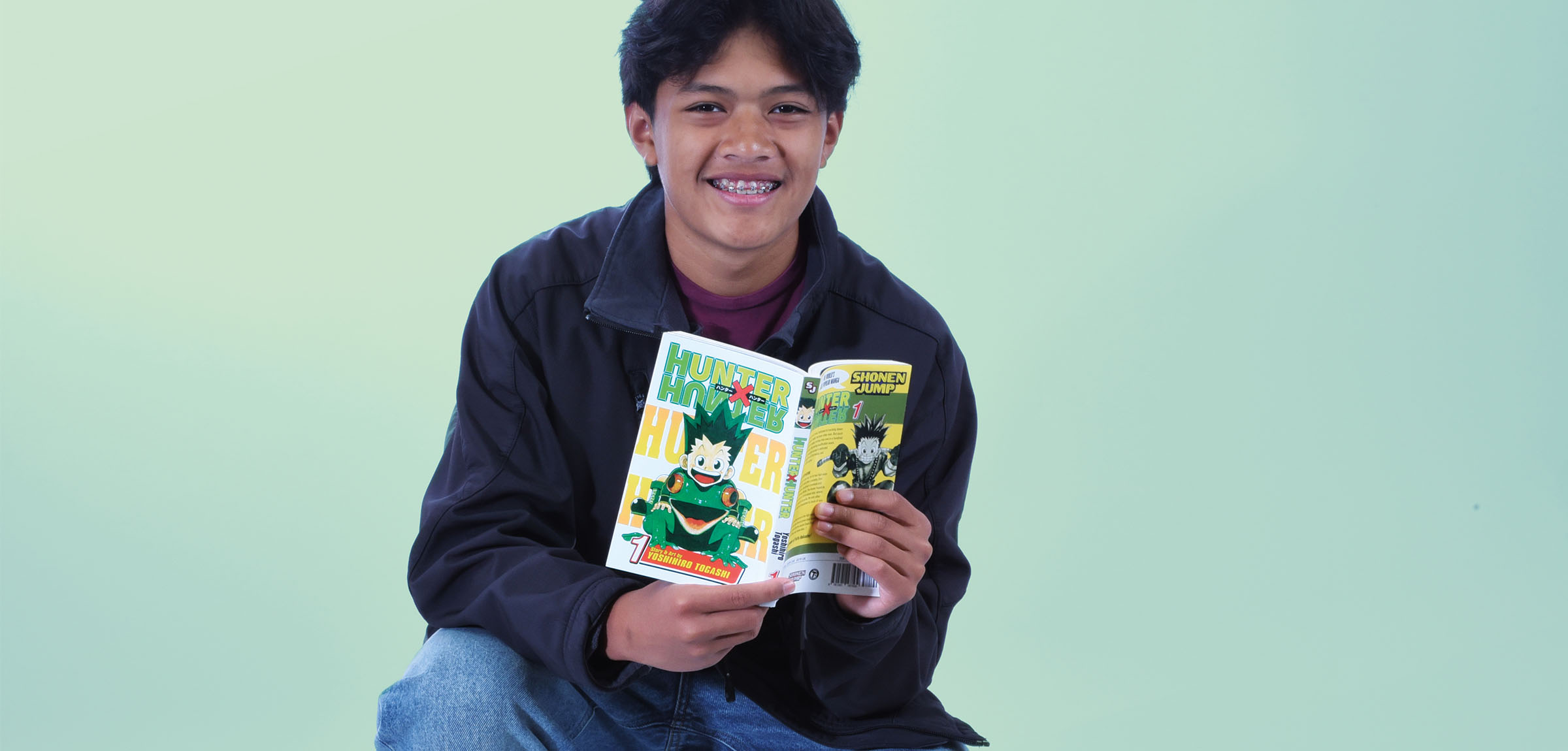 Young man holding a book Hunter Hunter
