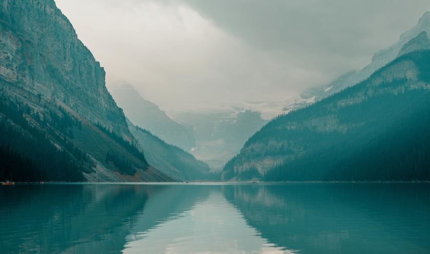 Lake reflecting the mountains in the distance