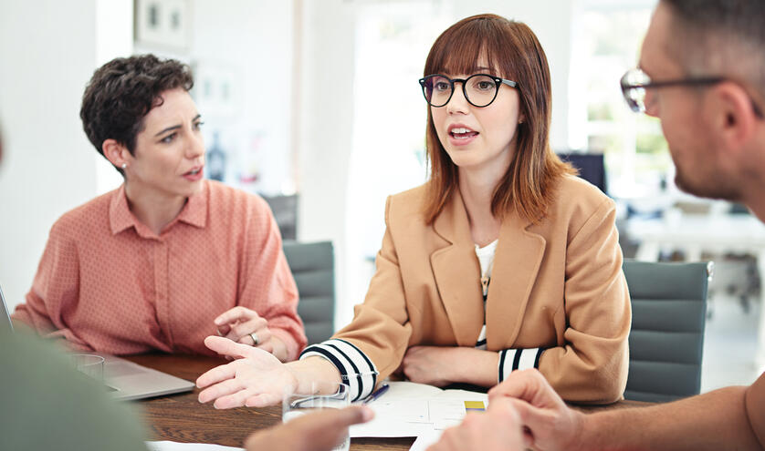 Women speaking up at meeting