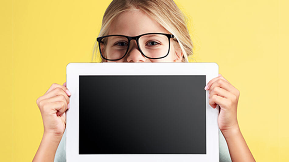 young girl wearing large black glasses holding a tablet over half of her page