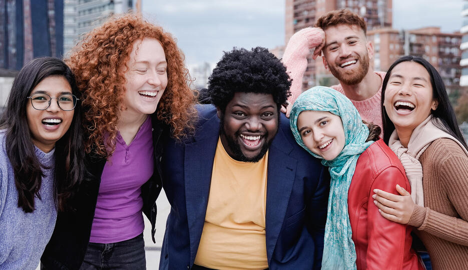 Group huddled outside smiling