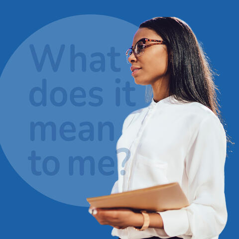 Women wearing glasses and white blouse holding a book