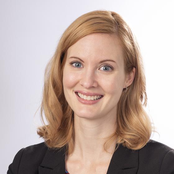 Portrait of a smiling caucasian blonde women with a white background