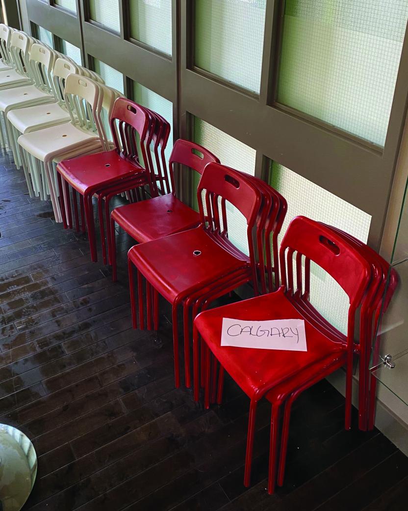 112 red and white chairs that will be used in an ATA billboard