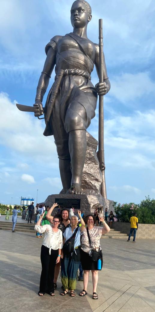 Project Overseas participants stop for a photo-op in front of the Benin Amazone, a statue built in homage to the world’s only all-female army.