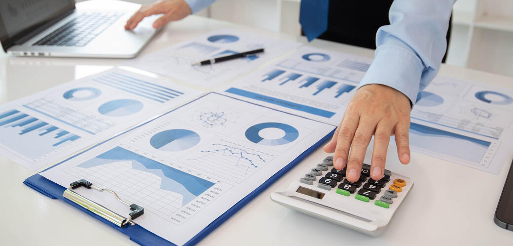 Desk filled with paper graphs