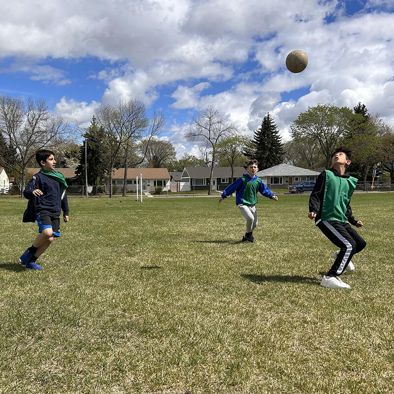 Students work on their soccer skills during recess