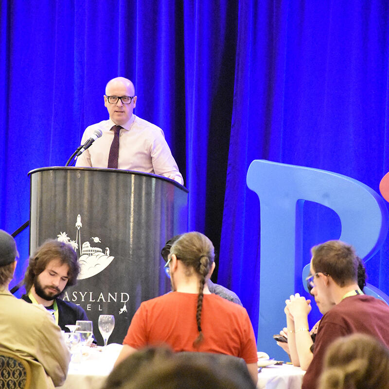 Jason Schilling speaks at a conference