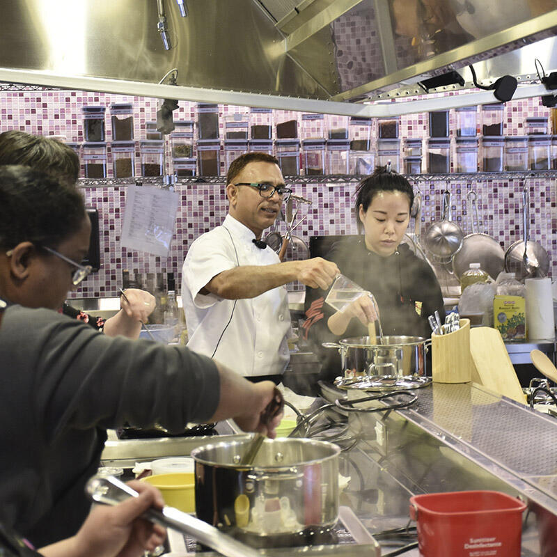 GETCA attendees participate in a cooking class
