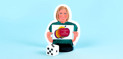 An illustrated boardgame player piece sits on a blue background in front of a die. The illustration of Melanie shows her with a blonde bob hairstyle, wearing a green short-sleeved shirt, holding a "I support AB teachers" graphic.