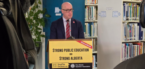 A passionate man speaking at a podium in a library