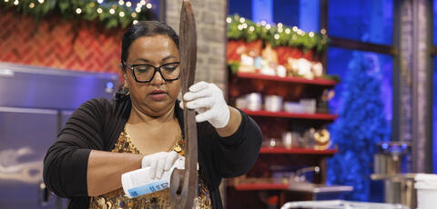 Renu Mathew creating a dessert on the show Sweet Empire: Winter Wars