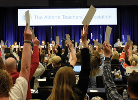 Albertan teachers wave their hands in the air at the 2022 ARA