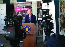 Jason Schilling gives a news conference