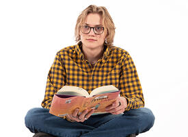 Young adult with an open book