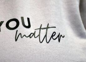 A close up of a shirt that reads, "You matter"