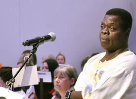 An ARA attendee listens in response to his question