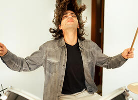 A long-haired drummer