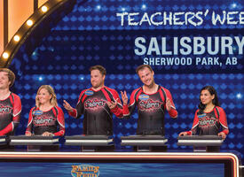 Sherwood Park teachers standing at the Family Feud podium