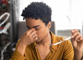 Women pinching now from a  headache