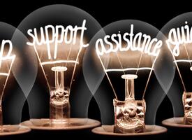Lightbulbs with the words Help, support , assistance and guidance written in the filaments
