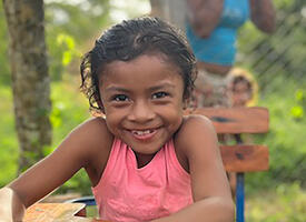 Close up of a child in a tropical jungle