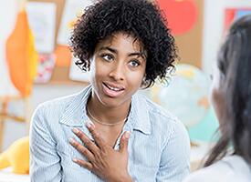 Parent and teacher in a conversation