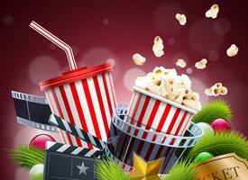 Popcorn, movie camera and ticket in front of a red curtain