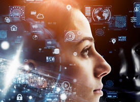 computer jargon, icons, charts, bar graphs in a translucent blue over the profile of a woman's face.