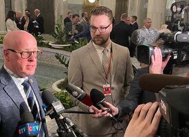 ATA president speaks to reporters in the Alberta Legislature rotunda