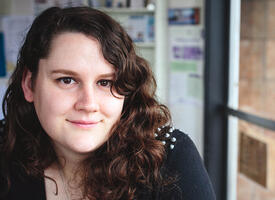 Portrait of a brunette curly haired women