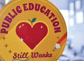 Public education sticker adhered to an office window